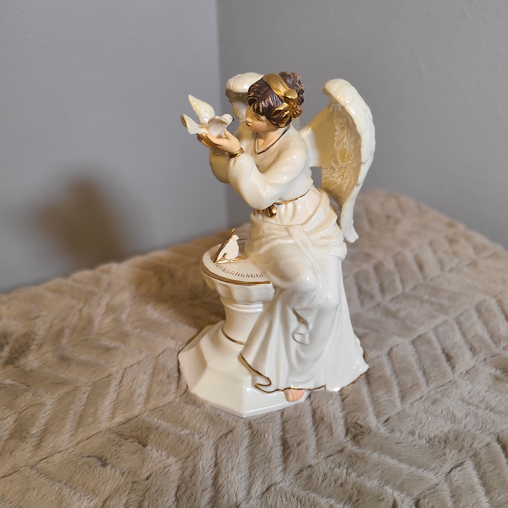 Ivory Ceramic Angel Figurine with Gold Accents